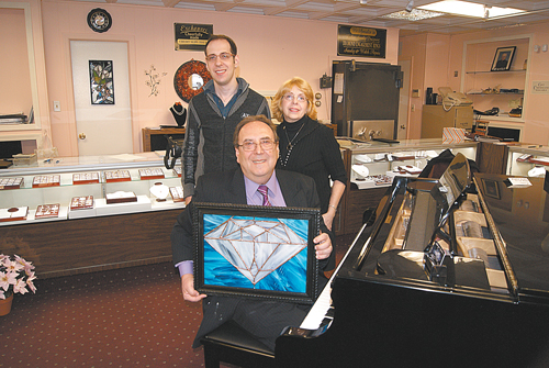 Photo by Karen ZautykRichard Donato with son, Rick, and wife, Joan. (Rick, in addition to being a jeweler, also works in stained glass, one example of his craft proudly displayed by his dad.)