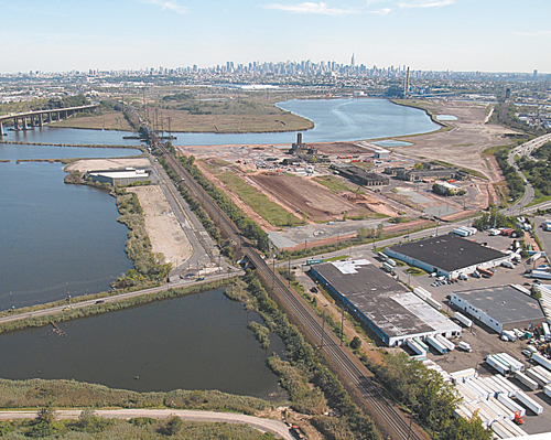 Photo courtesy NJMCAn aerial view of the Koppers Coke Peninsula in South Kearny with New York skyline in background.