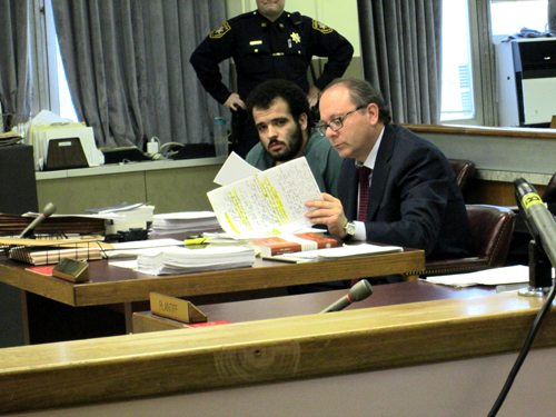 Photos by Ron LeirCarlos Campos confers with his attorney Joseph Russo.