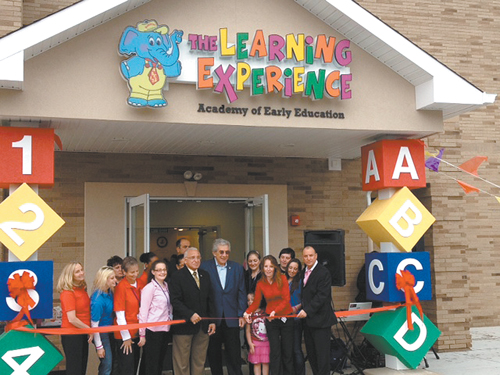 Mayor Robert Giangeruso (c.) presides at ribbon-cutting for grand opening of The Learning Experience in Lyndhurst in September.