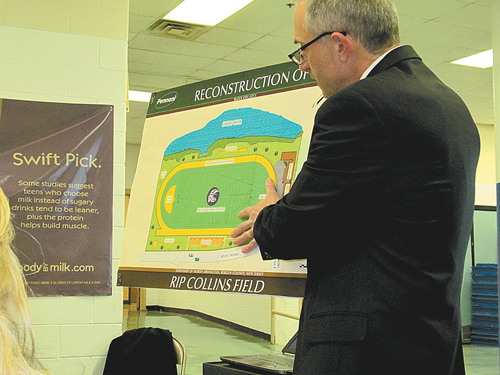 Photo by Ron Leir Schools Superintendent Oliver Stringham displays rendering of proposed improvements to Rip Collins Field