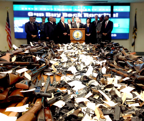 Photo courtesy Office of N.J. Attorney General Law enforcement authorities display weapons collected at Newark press conference.