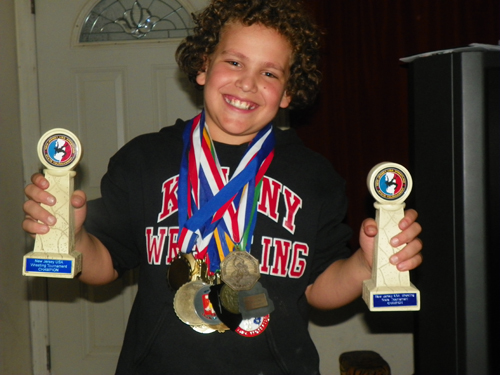 Photos by Jim Hague Kearny’s Jim Mullen is all smiles after winning his second straight New Jersey scholastic state championship. Mullen is wearing many of the medals he has won during his three-year wrestling career.