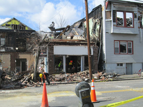 Photo by Ron Leir Demolition crews work on site clearance in aftermath of destructive Harrison fire.
