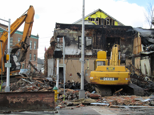 Photo by Ron Leir Excavators at work at Harrison fire scene