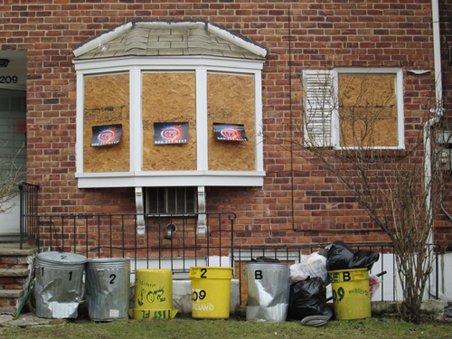 Photos by Ron Leir An abandoned toy, wrecked roofs and boarded-up windows were evidence of the damage done by the fi re that hit these Warren St. residences.