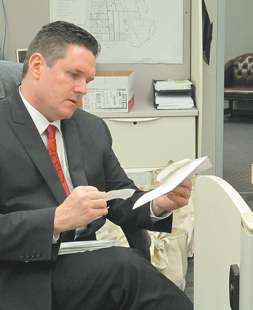 Photo by Ron Leir North Arlington Administrator Terence Wall checks vote totals on school referendum that paves the way for new high school athletic complex, as depicted below.