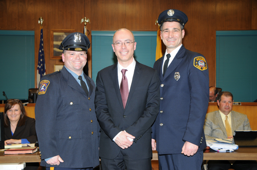 Photo courtesy of the KFD Mayor Alberto Santos congratulates newly promoted Kearny Police Sgt. Michael Ryan (l.) and Kearny Fire Capt. John DeGiovanni.