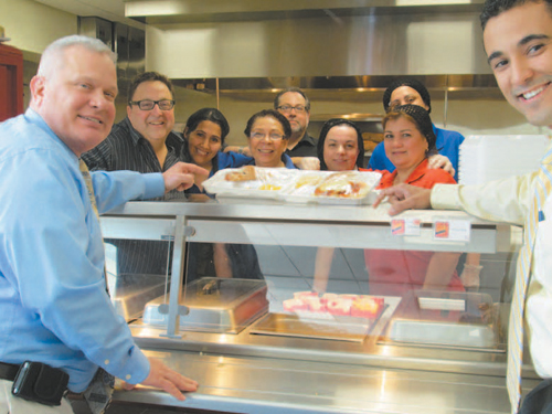 Photos by Ron Leir Superintendent of Schools James Doran (l.) and Washington Middle School Administrator in Charge Peter Santana (r.) and food service workers at Cafe Ole.