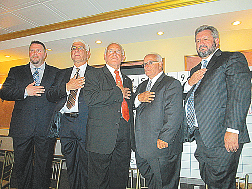 Photo by Ron Leir Winners of the Lyndhurst municipal election recite Pledge of Allegiance at victory headquarters.