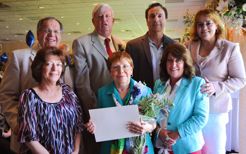 Photos courtesy of Hudson County government Harrison’s Sylvia Pomponi (c.) with Mayor Ray McDonough (back l.) and colleagues.