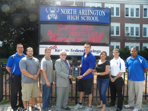 Photo by Jim Hague North Arlington graduate A.J. Nocciolo (center, r.) receives the 2012-2013 Observer Male Athlete of the Year award from Observer general manager Robert Pezzolla (center, l.). From l. are North Arlington High School Principal Louis Manuppelli, head baseball coach Paul Marcantuono, head football coach Anthony Marck, Pezzolla, Nocciolo, A.J.’s mother Cesarina Petracca, Vice-Principal Dennis Kenny and athletic director Dave Hutchinson.