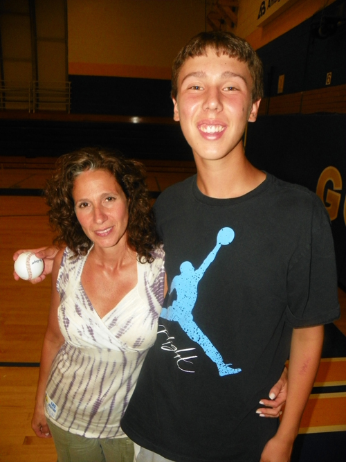 Photo by Jim Hague Lyndhurst High School pitcher Nolan Kelly gives a hug to his mother, Maria, an early childhood teacher in Lyndhurst. Kelly has overcome Tourette syndrome to be a solid member of the Lyndhurst varsity baseball team.