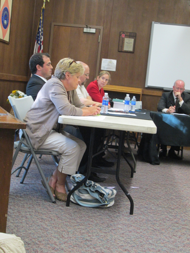 Photo by Ron Leir Bernadette McDonald (in foreground) awaits outcome of vote on presidency. To her right are: Trustees Dan Esteves, James Doran Jr. and Cecilia Lindenfelser and Counsel Ken Lindenfelser.