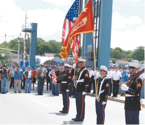 Photos by Karen Zautyk Osmany Montes De Oca, who is Osbrany’s twin; Maria Samaniego, Osbrany’s girlfriend; and the Marine’s mother, Miriam Montes De Oca (l. to r.) at ceremony, which featured Marine Corps Color Guard