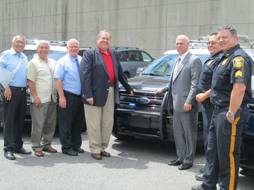 Photos by Ron Leir Checking out the new police cars, from l., are Town Councilmen Victor Villalta, Jesus Huaranga and James Doran, Mayor Ray McDonough, Police Chief Derek Kearns, Sgt. David Strumolo and Sgt. Rich Lourenco.