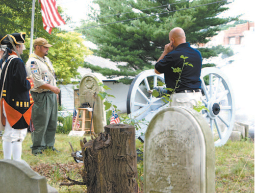 Photos by Karen Zautyk Boy Scouts and Cub Scouts at Roll of Honor monument, who didn’t even fl inch as cannon’s roar later shook the air.