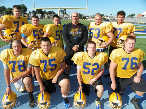 Photo by Jim Hague The Lyndhurst football team opens Sept. 14 at Wood-Ridge. Front row, from l., are Jonathan Carbone, Brian Perez, Fred Rivers and Connor Clifford. Back from l., are Albert Saiti, Nick Antiorio, P.J. Urgola, head coach Joe Castagnetti, Denniz Akar and Tony Urgola.