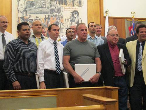 Photo by Ron Leir Members of Nutley Auxiliary Police receive congratulations and plaques from Mayor Alphonse Petracco (r.) and fellow commissioners.