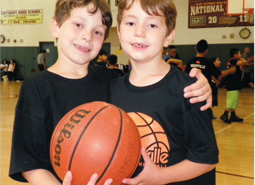 Photo by Jim Hague The Mullins brothers, 7-year-old Matheus and 8-year-old William, of Kearny had a ball at the Hoopsville Cares basketball camp in Jersey City.