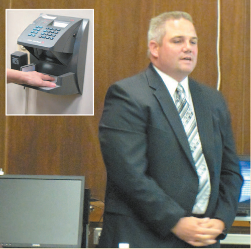 Photos by Ron Leir Kearny BOE employees could end up “clocking in” using electronic palm readers like the one (inset) at Town Hall furnished by ADP, whose sales representative Vincent Kelly pitched his product to the BOE.
