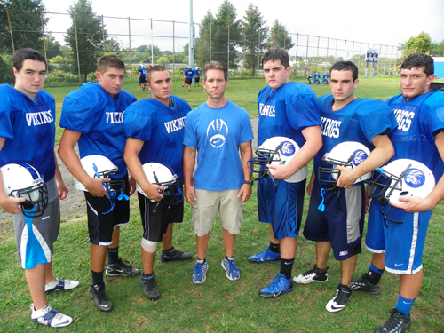 Photo by Jim Hague The North Arlington football team looks to be much improved over the 4-6 mark they posted last season. From l. are Ryan Austin, Dominic Reo, Brandon Pipher, head coach Anthony Marck, Matt Karras, Danny Goffredo and Anthony Muriale