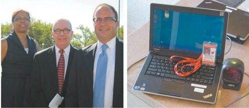 Photos by Ron Leir LEFT: At KHS convocation, from l., are Assistant Superintendent Debra Sheard, consultant Charles Ivory and Superintendent of Schools Frank Ferraro. RIGHT: Laptop "registers" KHS students via scanner and ID card.