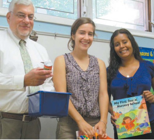 Photo by Ron Leir Sampling some of the wares at new East Newark pre-school, from l., are Superintendent/ Principal William Shlala, teacher aide Joanne Ribeiro and teacher Jennifer Palumbo.