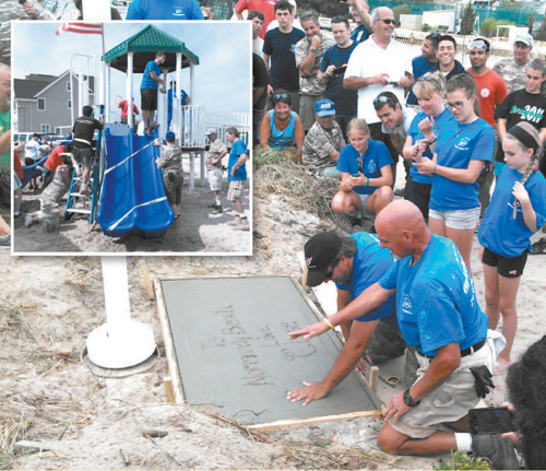 Photos courtesy Kearny FMBA Kearny fi refi ghters put finishing touches on playground in Normandy Beach.