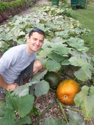 Photos courtesy Kearny Community Garden Gardeners strut their stuff; Jenny Mach holds a carrot and David Mach shows off pumpkins.