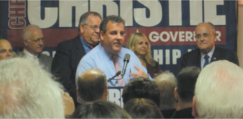 Photo by Ron Leir Gov. Chris Christie (c.) with Harrison Mayor Ray McDonough behind him and former N.Y.C. Mayor Rudy Giuliani, far right.