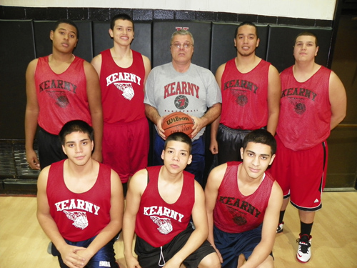 Photo by Jim Hague The Kearny boys’ basketball team opens the season this weekend against Bayonne with new head coach Bob McDonnell. Pictured here are the team’s seniors. Front row, from l., are Alfredo Urgiles, Isaac Osorto and Julio Vasquez. Back row, from l., are Amged Fraih, Joel Vivas, coach McDonnell, Joe Rodriguez and Michael Trama.