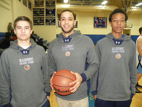 Photo by Jim Hague Harrison has enjoyed a fine 5-2 start to the high school basketball season. From l. are senior Tommy Dolaghan, head coach Noel Colon and senior Jeremy Mohamoud.