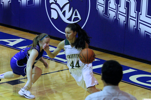 Top photo by Jim Hague, bottom courtesy Robert Rodriguez The Queen of Peace girls’ basketball team has been bolstered by the play of their seniors. TOP, from l., are Nikki Sammartino, Raychel Piserchia, Maria Ruiz and Lia Rodriguez. BOTTOM: Senior Lia Rodriguez controls the ball in a recent Queen of Peace girls’ basketball game against rival North Arlington.