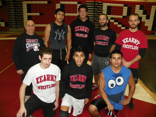 Photo by Jim Hague The Kearny High School wrestling team is experiencing some growing pains. Front row, from l., are James Hodnet, Wilker Villacorta and Luis Cornejo. Back row, from l., are head coach Tony Carratura, Giovanni Diaz, Johann Holguin, assistant coach Brian McDonnell and assistant coach Rich Stacey.