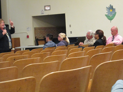 Photos by Ron Leir
Superintendent Patricia Blood,
explaining the district’s new policy on
a middle school, sought to reassure
doubters like board member John
Plaugic (in pink shirt) that changes
can be accomplished by September.