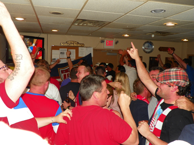 Photo by Jim Hague The avid soccer fans at the Kearny Scots-American Club erupt after Clint Dempsey scored an early goal against Ghana.