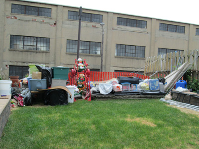 Photos by Ron Leir Neighbor’s backyard partly occupied by items previously stored in shed she was told to take down to make room for wall.