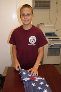 Photos by Karen Zautyk Boy Scout Kirill Pavlov, 13, of Nutley respectfully folding ‘retired’ American flag.