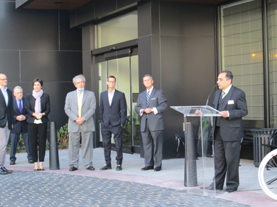 Photos by Ron Leir LEFT: Gary Maida, general manager of Crescent Hotels & Resorts, (at podium) is flanked, from l., by Richard Miller (The Pegasus Group), Michael Barry (Ironstate Holdings) and Michael Williams (Crescent VP). RIGHT: Fritz van Paasschen, Starwood CEO, at ceremonial opening for Element at Harrison.