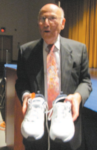 Photo by Ron Leir Belleville students presented a pair of sneakers as a gift to Ganz, who walks a mile and a half every morning.
