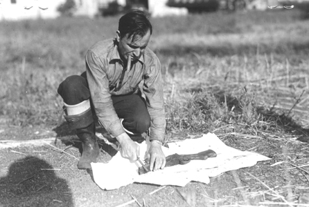 KPD Police photo, taken Aug. 18, 1936, shows Walter White of Jersey City, employee of the Hudson County Mosquito Exterminating Commission, with shotgun/murder weapon he found in a creek in the meadows.