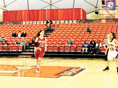 TOP PHOTO: Photos by Jim Hague Harrison native Rayven Lucas (l.) and Kearny’s Janitza Aquino (r.) are two of the reasons why the Montclair State women’s basketball team is ranked No. 10 nationally among NCAA Division III schools and own an impressive 20-1 record this season. ABOVE: Photo by Jim Hague Kearny’s Janitza Aquino (15) brings the ball up the floor against Rutgers-Newark last week. Aquino is leading Montclair State in scoring with a 15.8 point per game average.