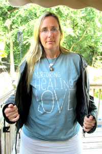 Photos by Bobby Travieso TOP: Bobby Travieso at Black Jack Exhibit at North Arlington Pu blic Library. ABOVE: Scarlett Lewis displays T-shirt.